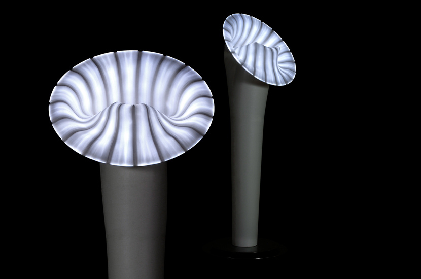 A trumpet shaped floor lamp made of silicon