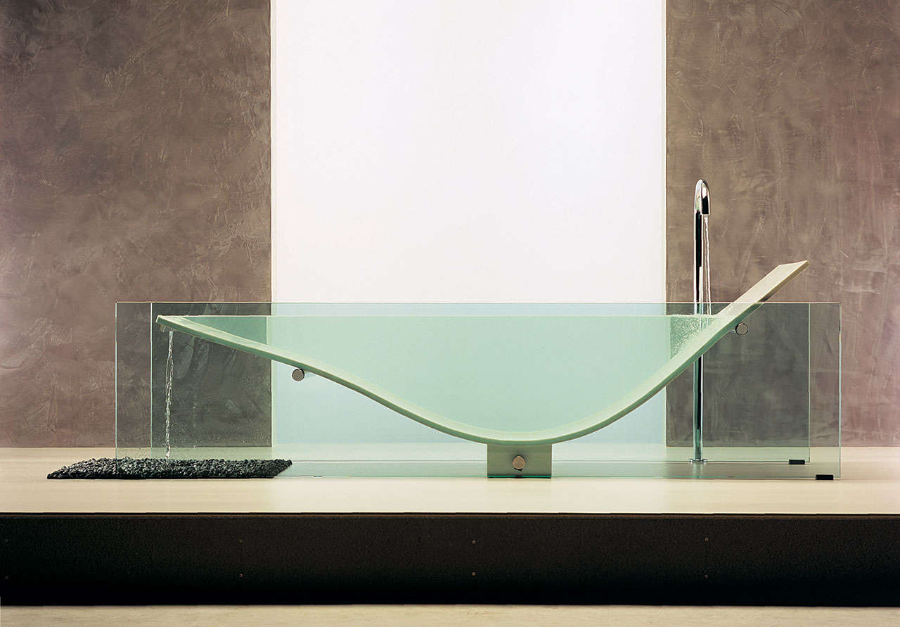 A bathtub made with glass and Corian