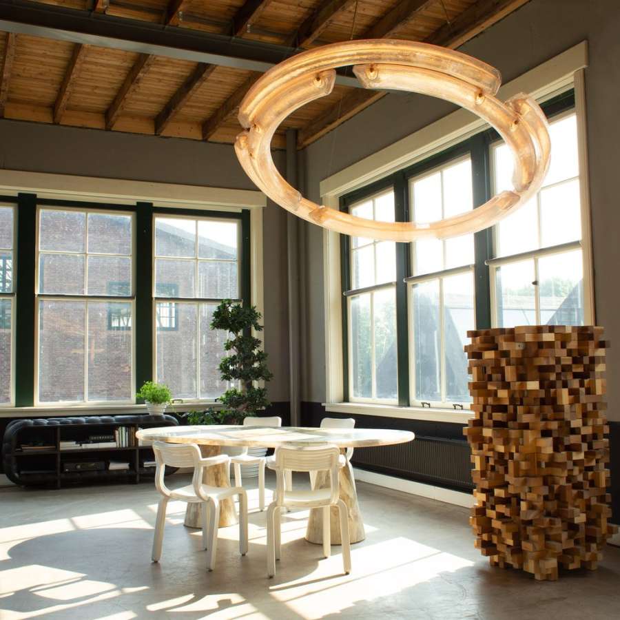 Chandelier made of recycled rooftop windows, safety glasses and industrial chocolate molds