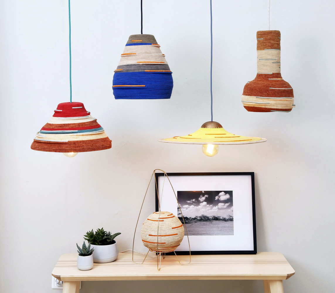 Pendant light fixtures with handwoven shades by W. African refugees