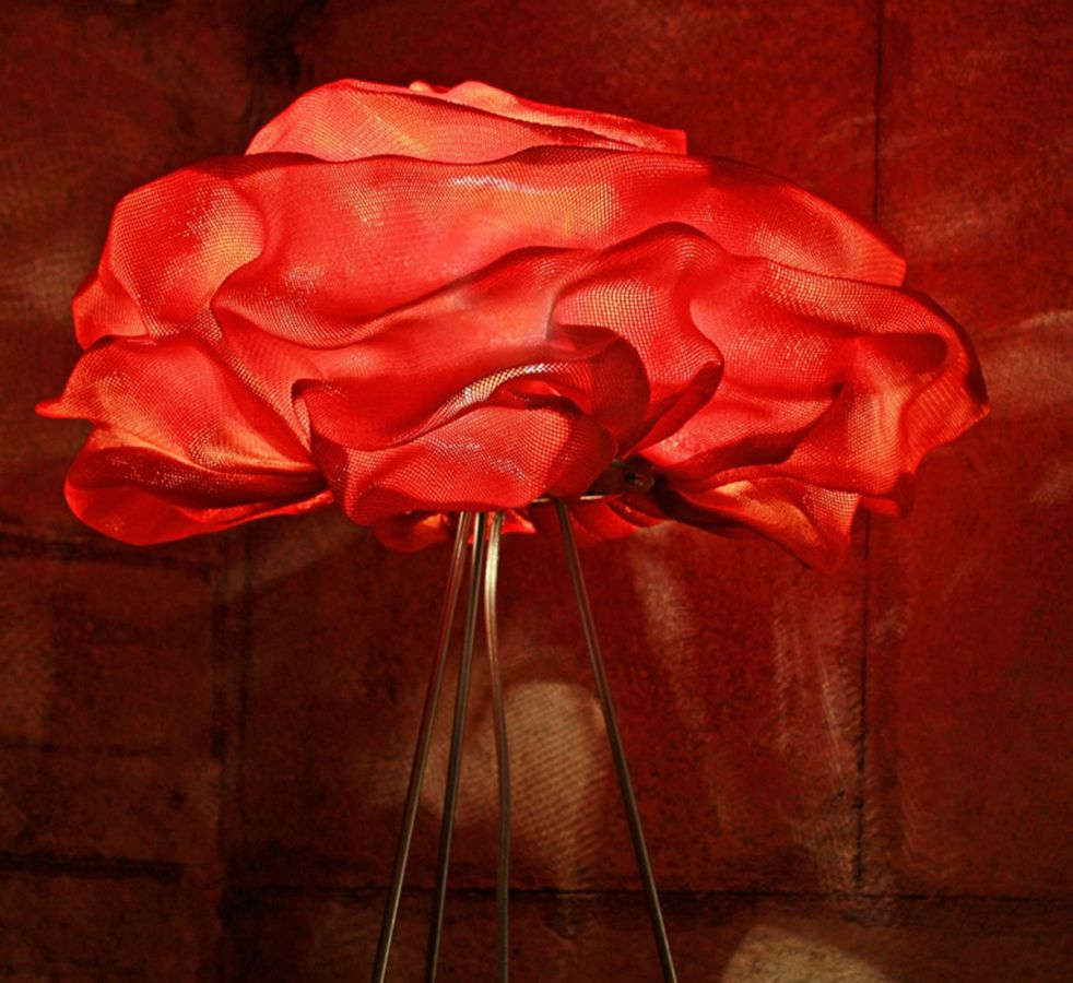 A table lamp of scrumpled painted steel mesh to resemble a rose