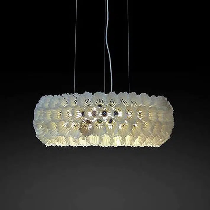 Pendant light fixture with shade from discarded badminton shuttlecocks