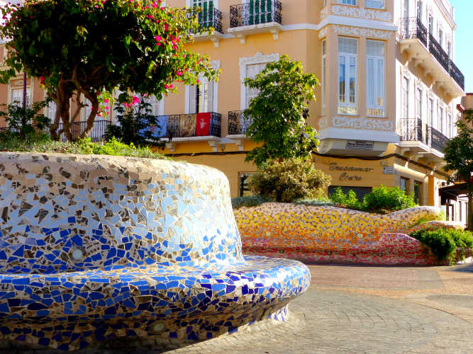 Colorful mosaic tile planter benches in Plaza Héroes de España, Melilla