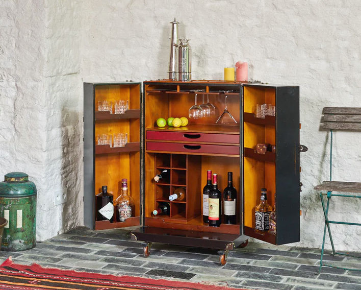 Inside view of steamer trunk inspired mobile drinks cabinet