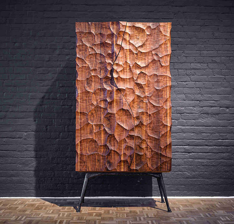 Drinks cabinet with highly textured face inspired by the turbulent meeting of the Indian and Atlantic Oceans