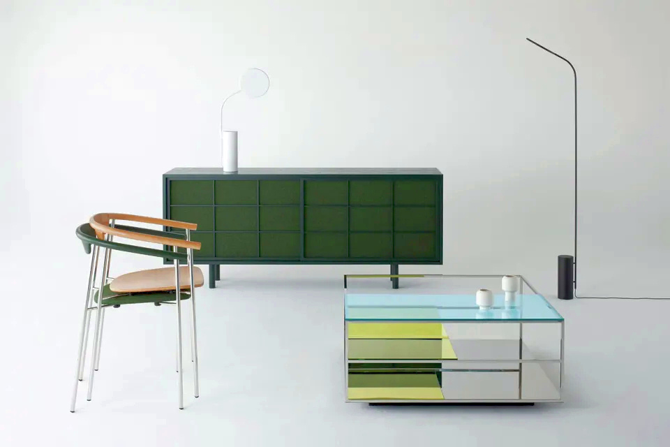 Coffee table with colored glass panels that can be rearranged to change its looks