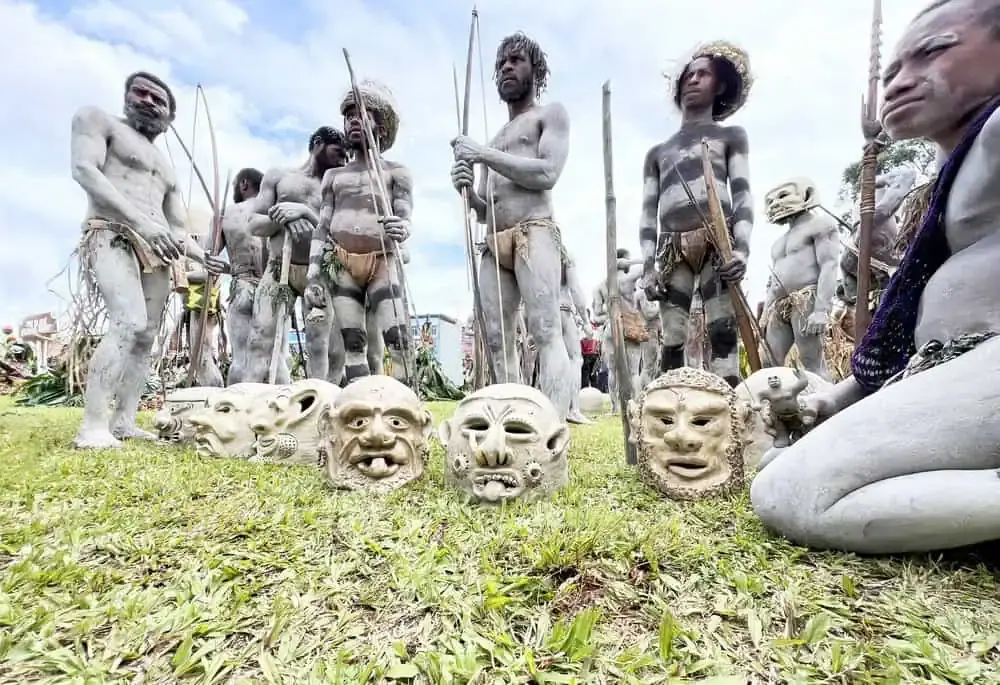 Asaro River Polga Mudmen lined up behind their masks